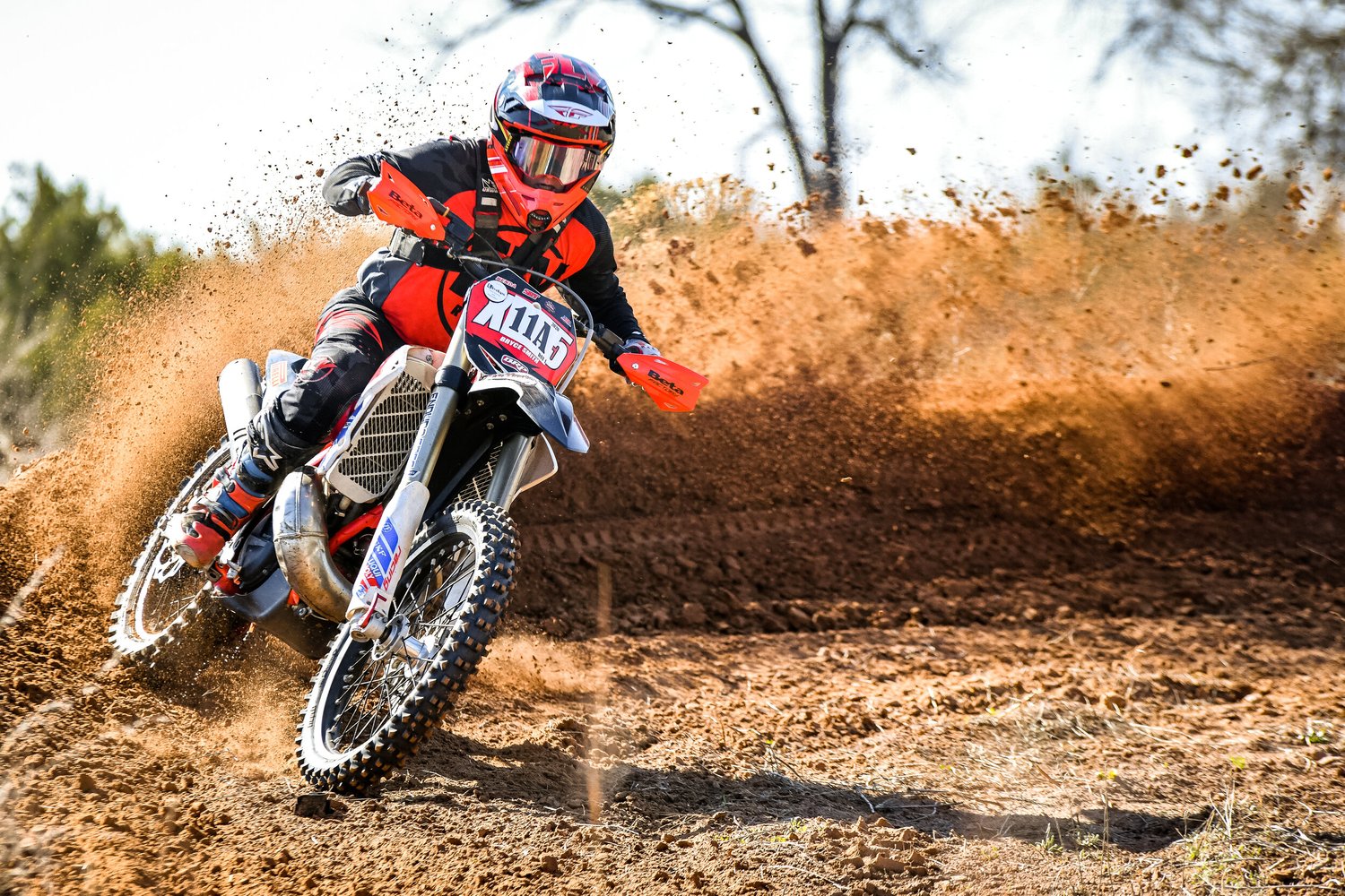 Extreme sports athlete performing daring dirt bike stunts